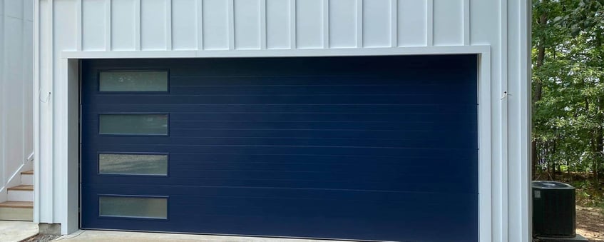 Example of a grey house with blue garage door