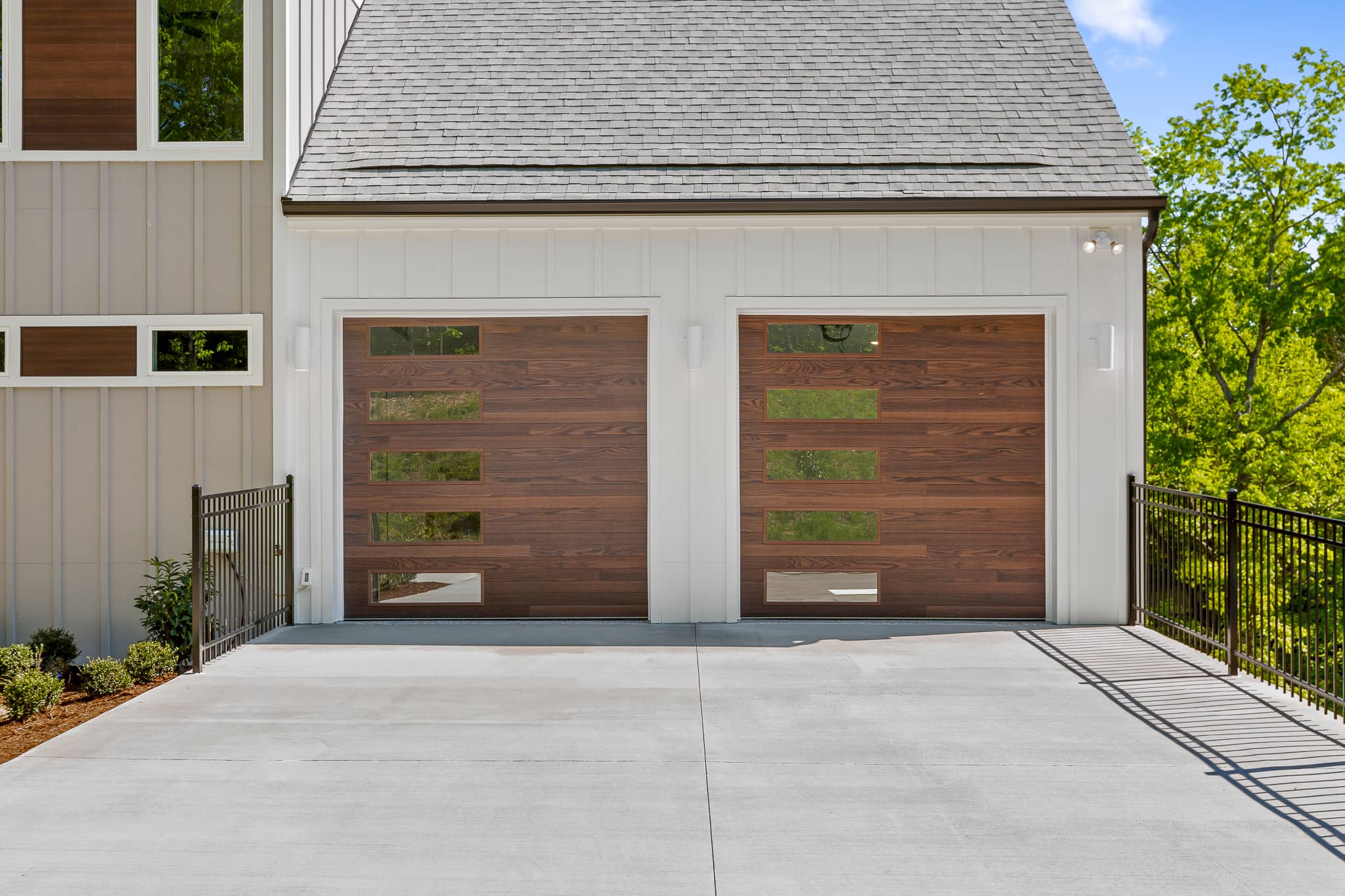 planks garage doors in dark oak accents woodtone