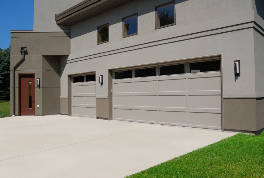 Stamped carriage house garage doors in sandstone-1