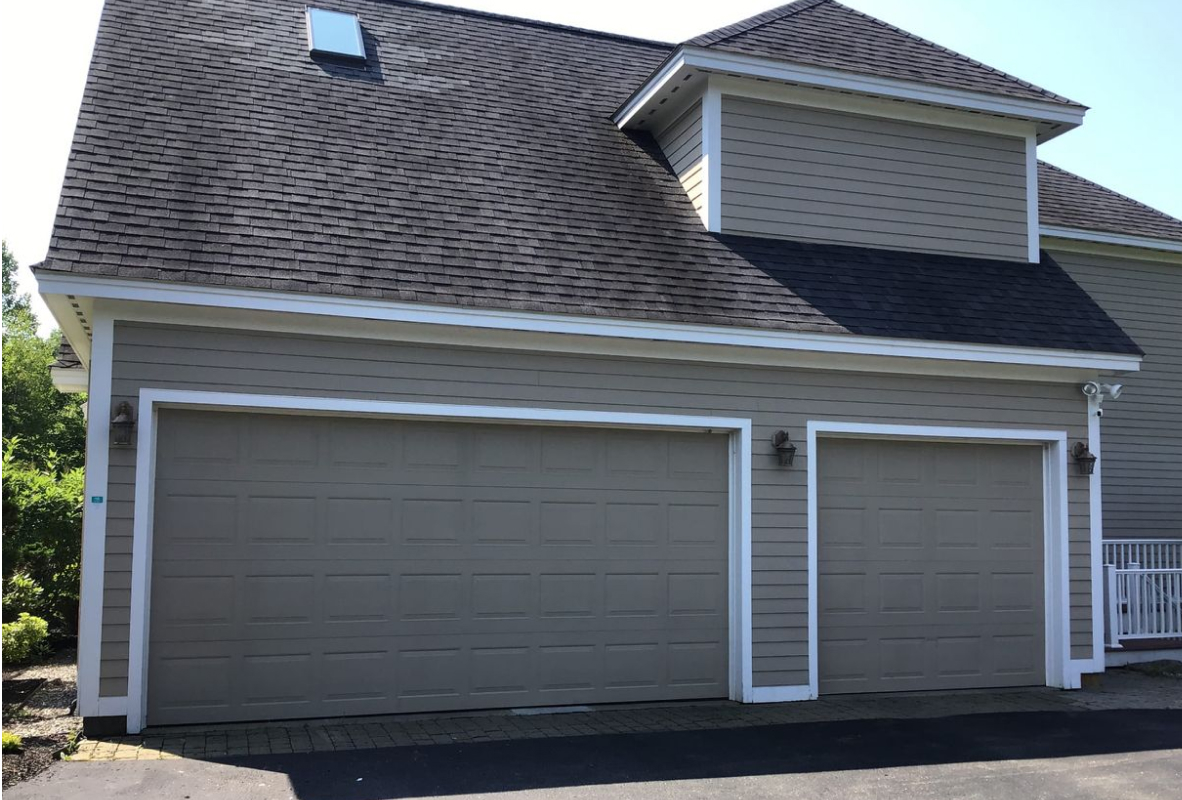 Stamped carriage house garage doors in gray