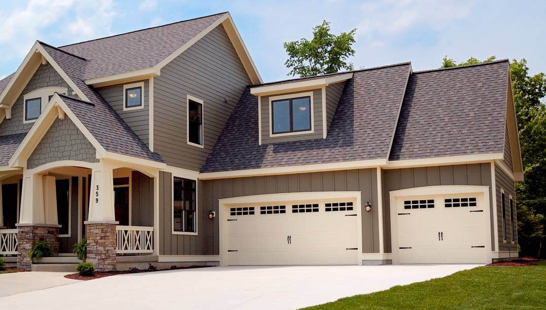 almond stamped carriage house garage doors