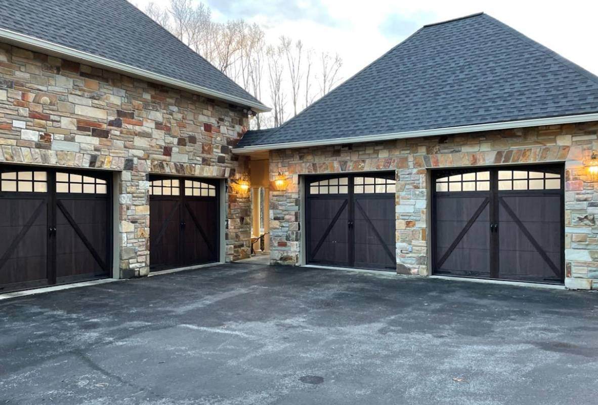 Overlay carriage house shoreline ranch-style garage doors in walnut