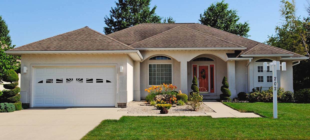 Raised panel ranch-style garage doors in white