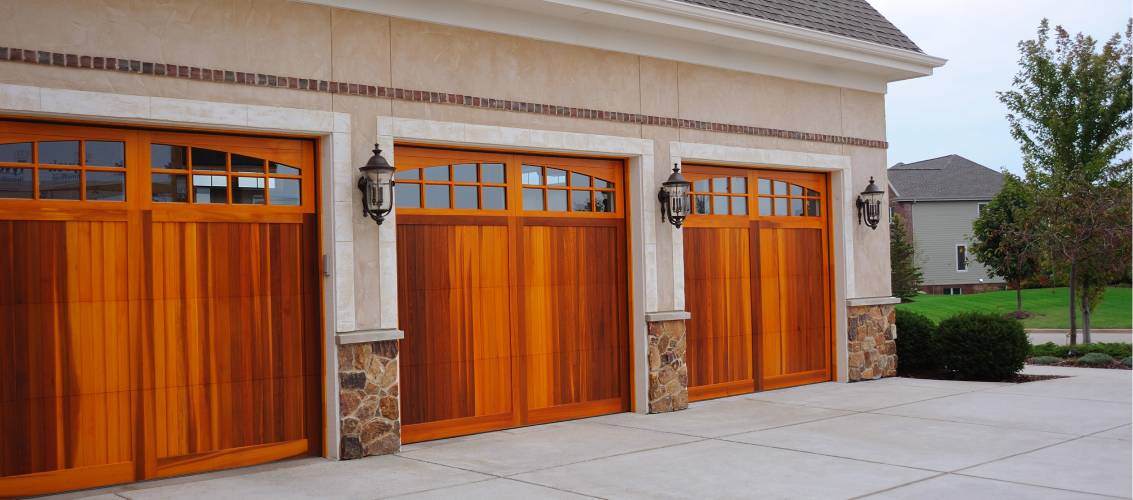 Wood overlay carriage house ranch-style garage doors