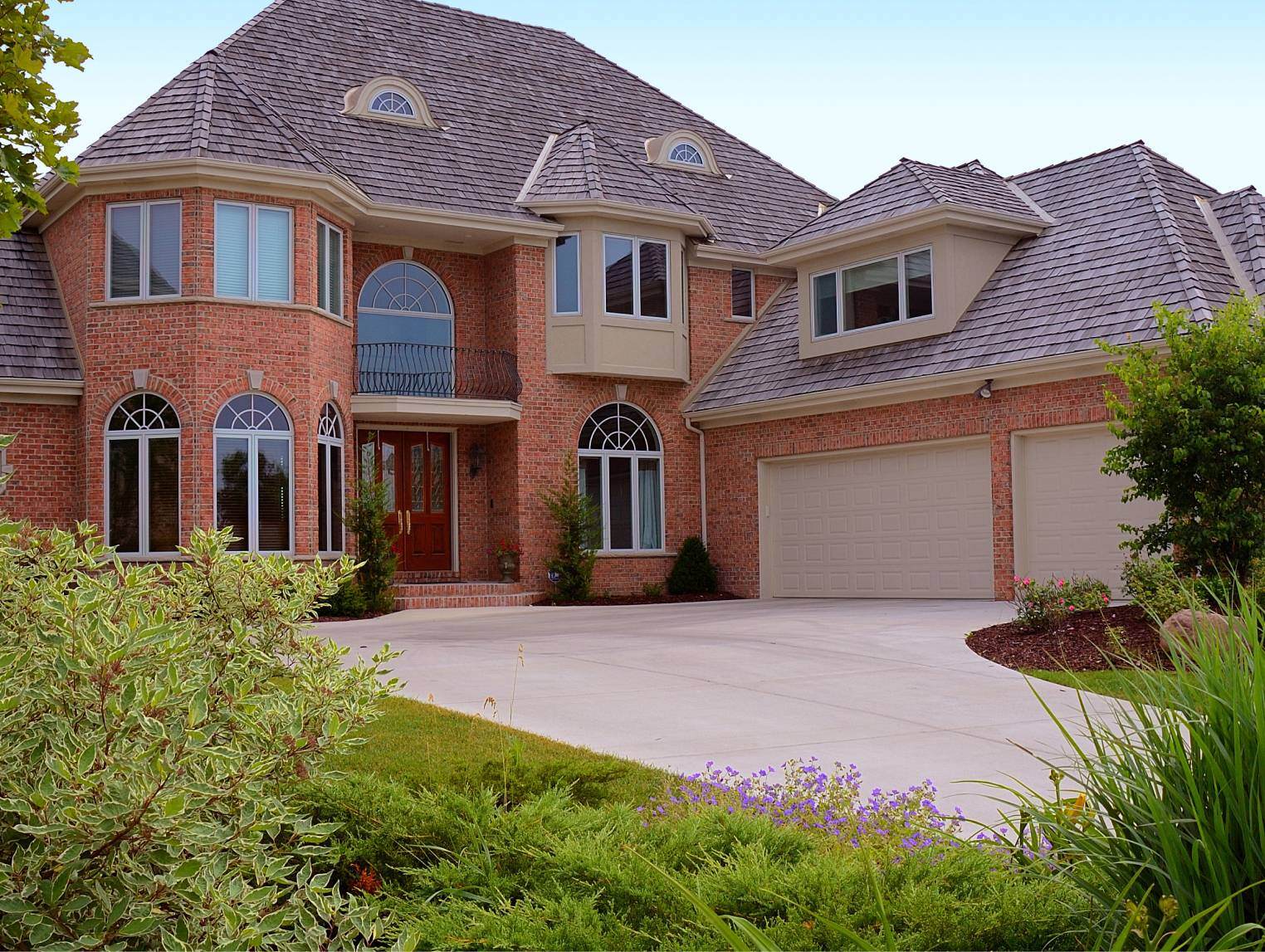 Raised panel garage door in desert tan