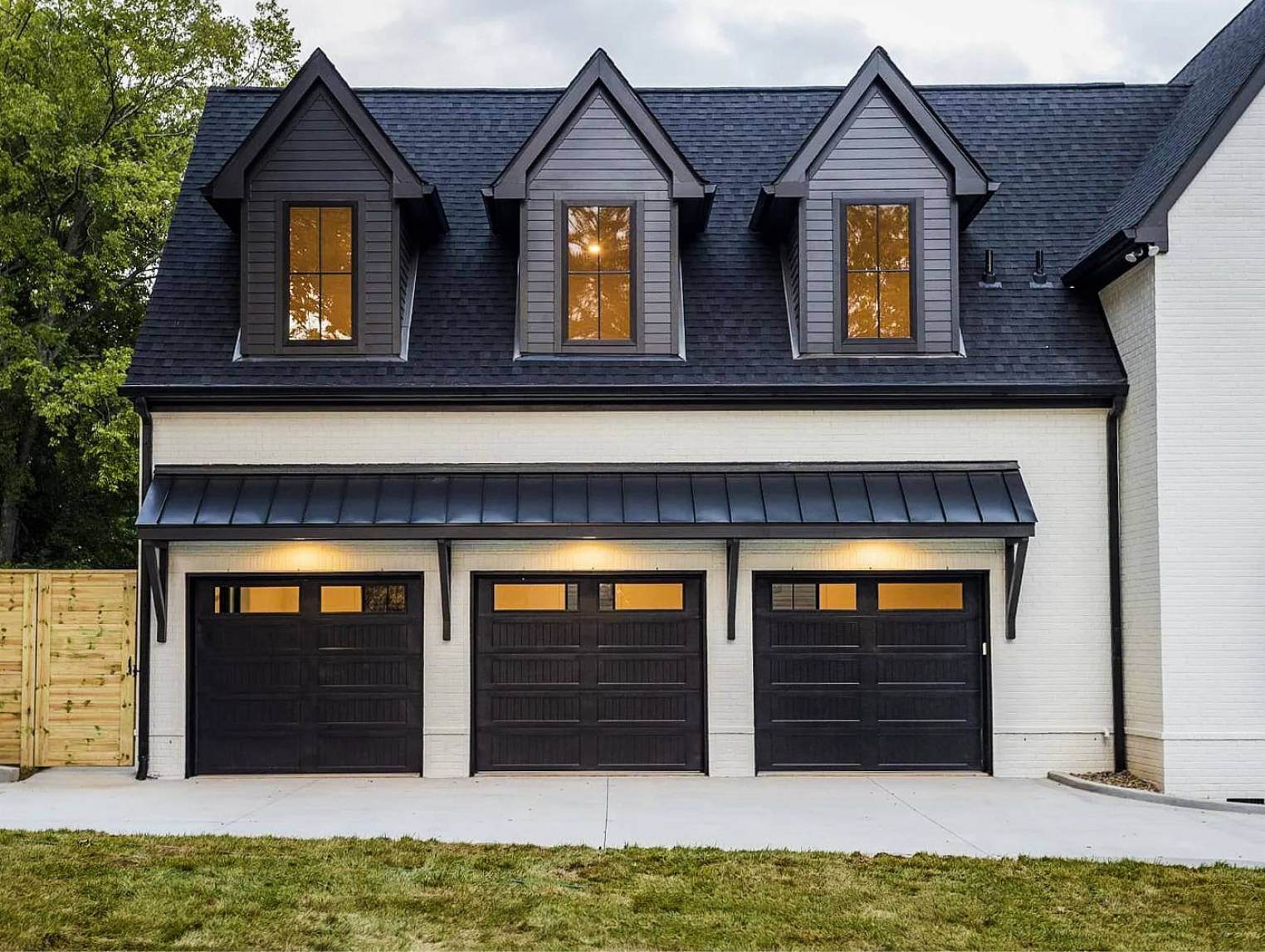 Stamped carriage house garage door in black