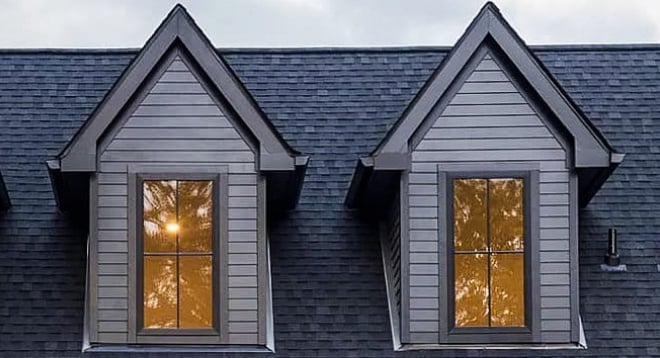 close up of dormers with gray panneling